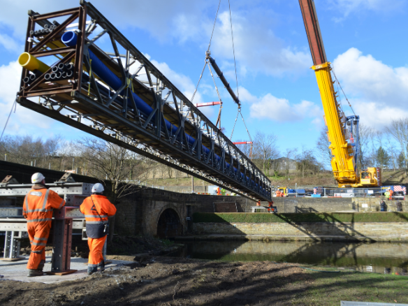 Power and energy crane lifting temporary bridge