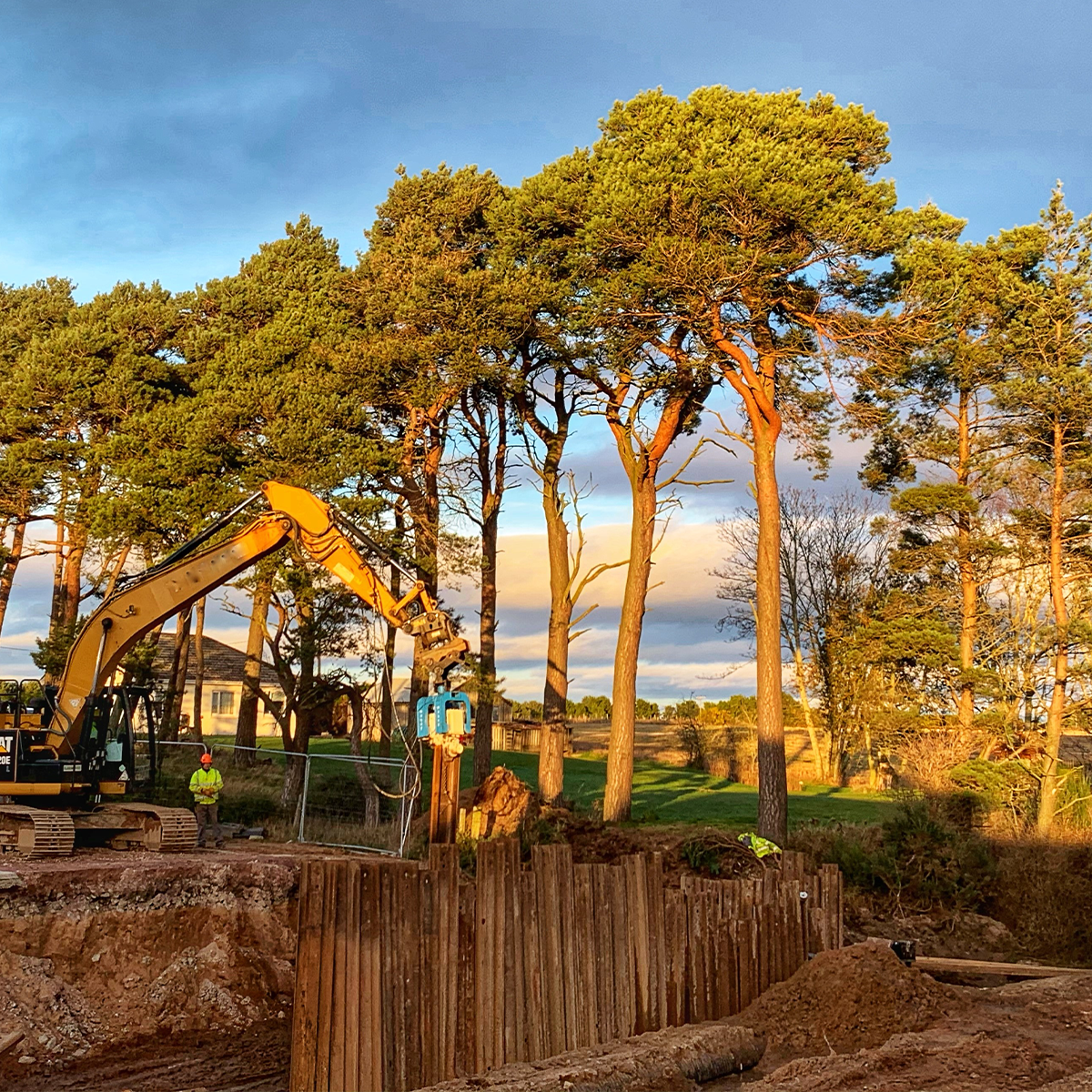 MH International excavator mounted vibrator (EMV) on site in woodland
