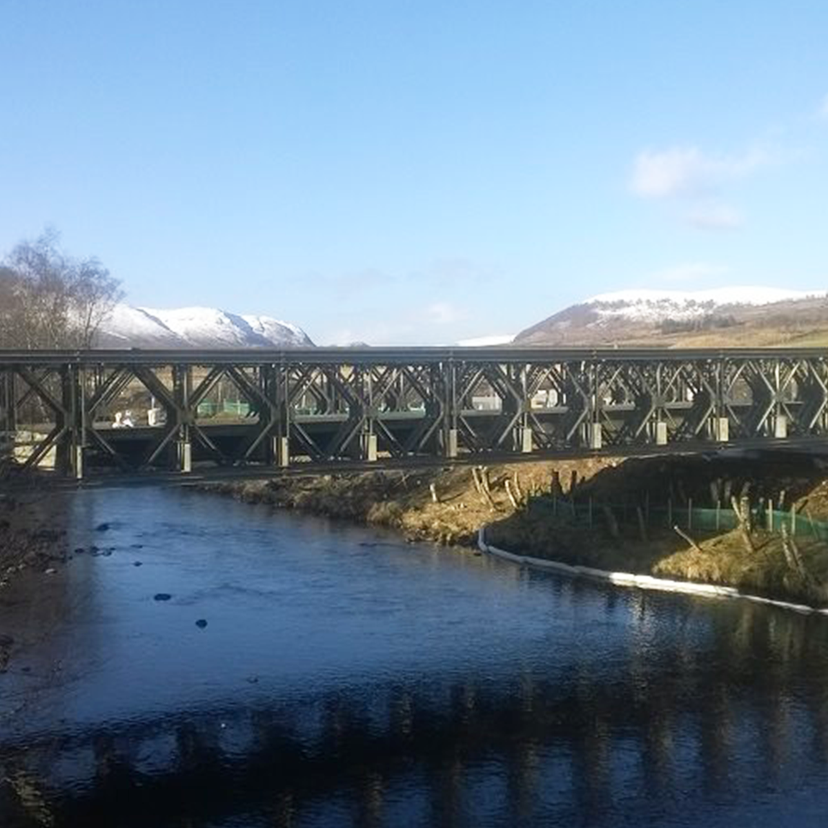MH International MU bridge on site over river