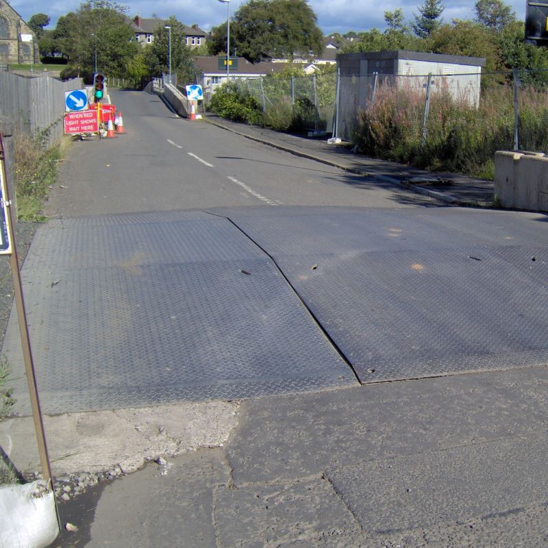 MH International trench crossing unit on a road